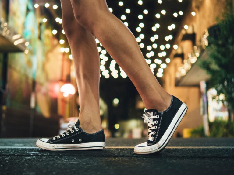 woman showing knees and black tennis shoes